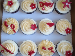 A dozen ivory and ruby cupcakes